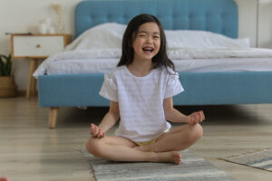 child doing butterfly pose